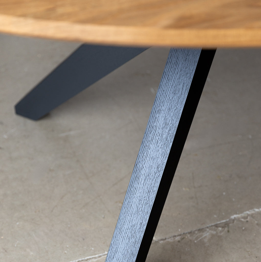 Close-up image highlighting the modern leg design of the table, drawing inspiration from mid-century modern aesthetics, embodying sleek lines and minimalist elegance.