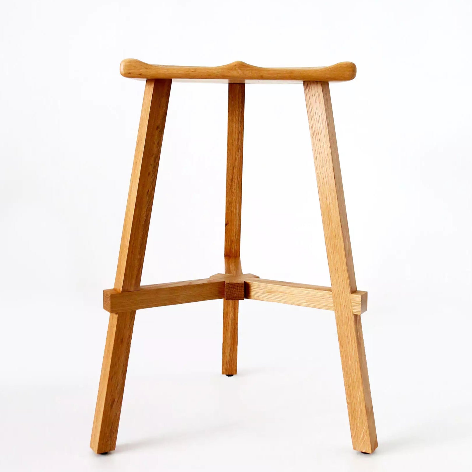 Wooden bar stool on a white background