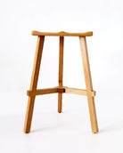 Wooden bar stool on a white background