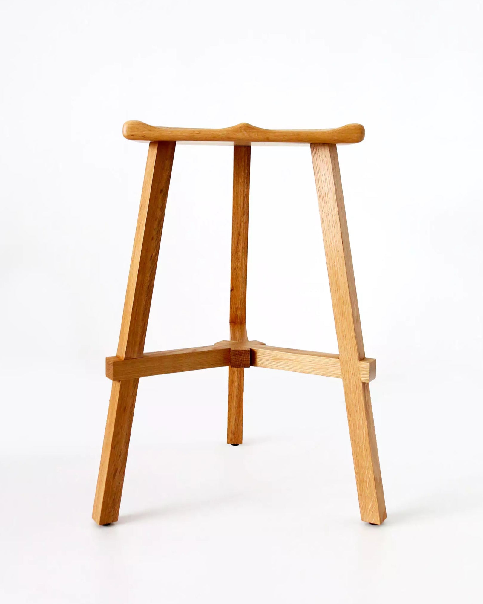 Wooden bar stool on a white background