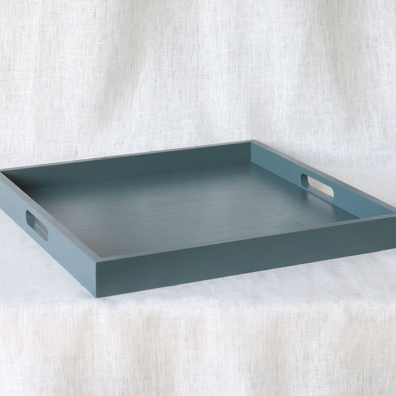 Side-angle perspective of the empty tray showing its low profile and minimalist form.