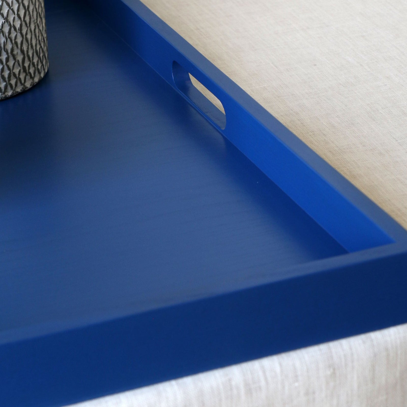 Close up of the blue tray's oval-shaped handle