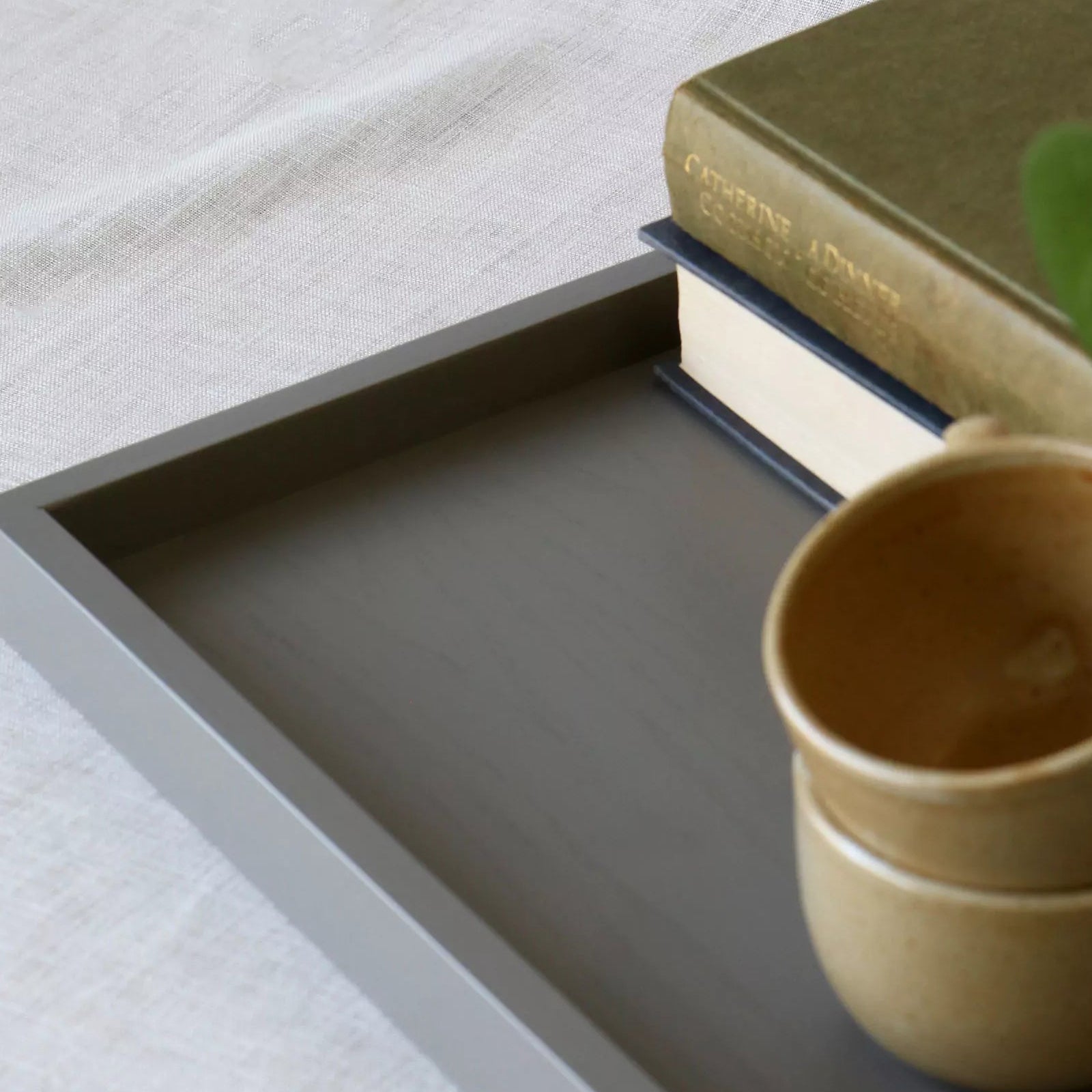 close-up of a grey lacquered tray and it's corner frame detail