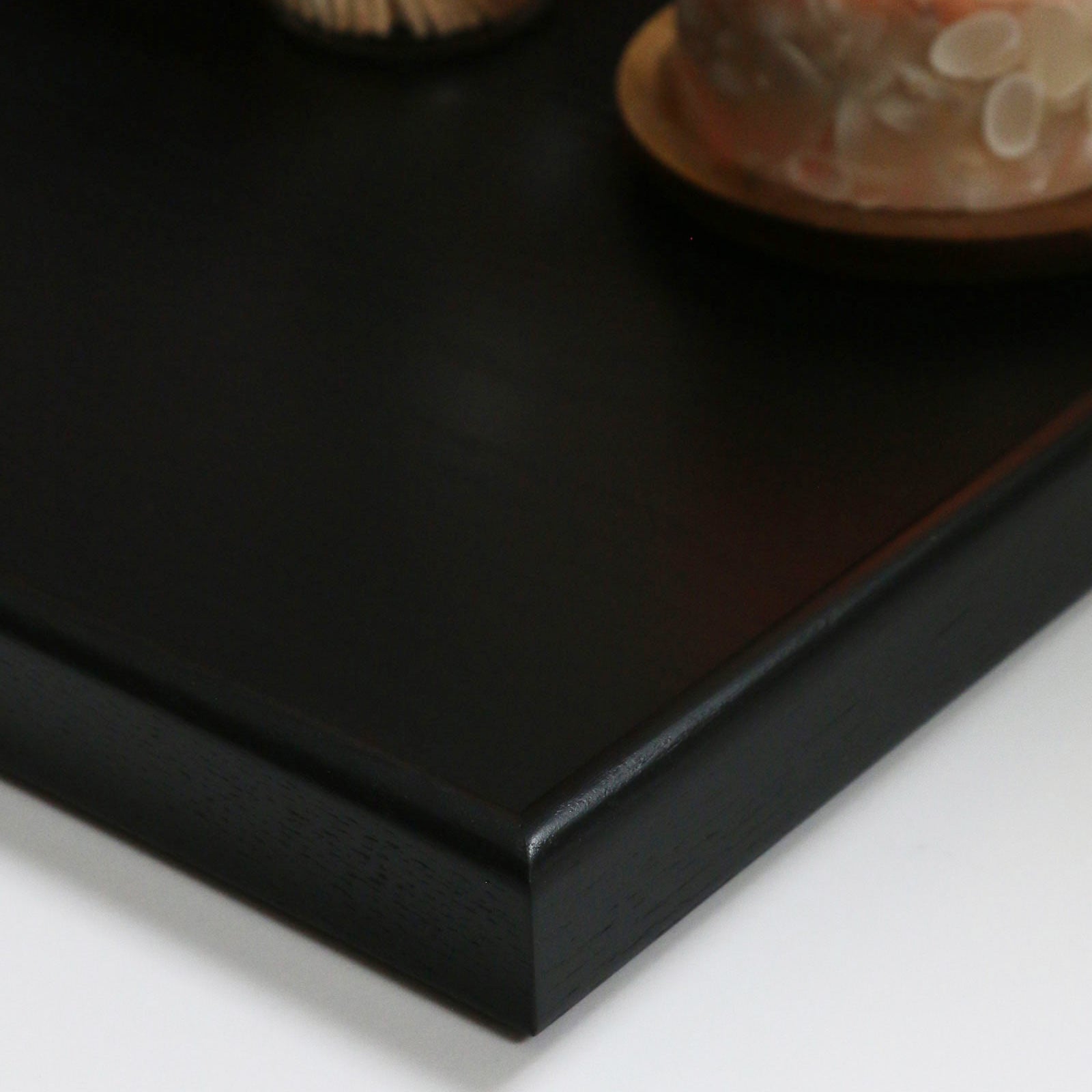 A detailed close-up of the smooth surface and fine joinery of a handcrafted tray, showcasing its premium quality.