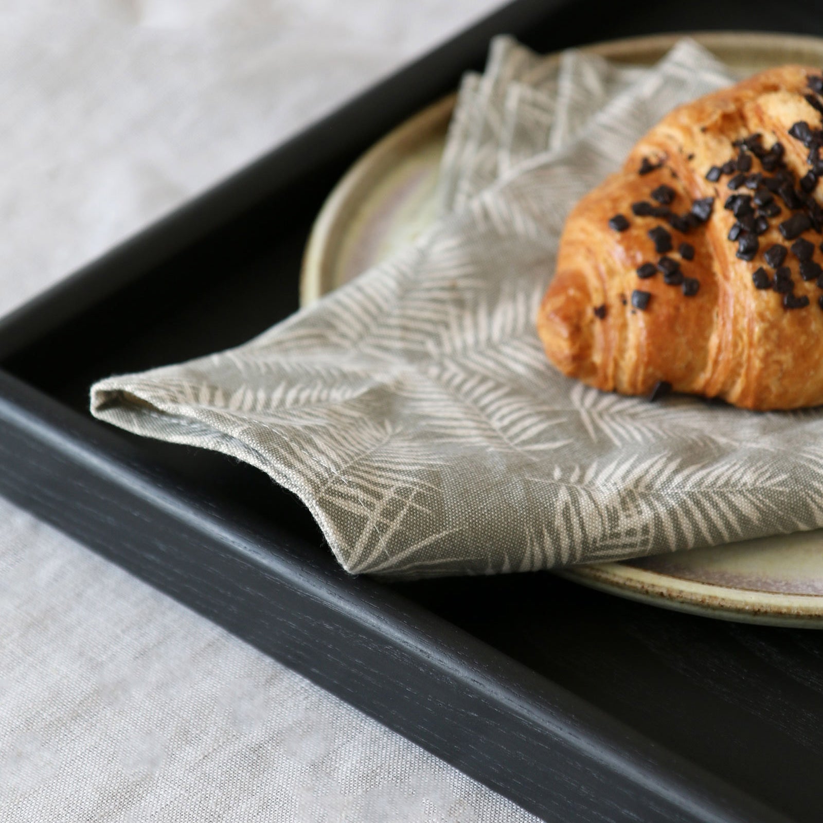 Close-up of a handcrafted tray, showcasing its rich wood grain with a warm black stain, perfect as a wooden tray for footstool or coffee table tray.