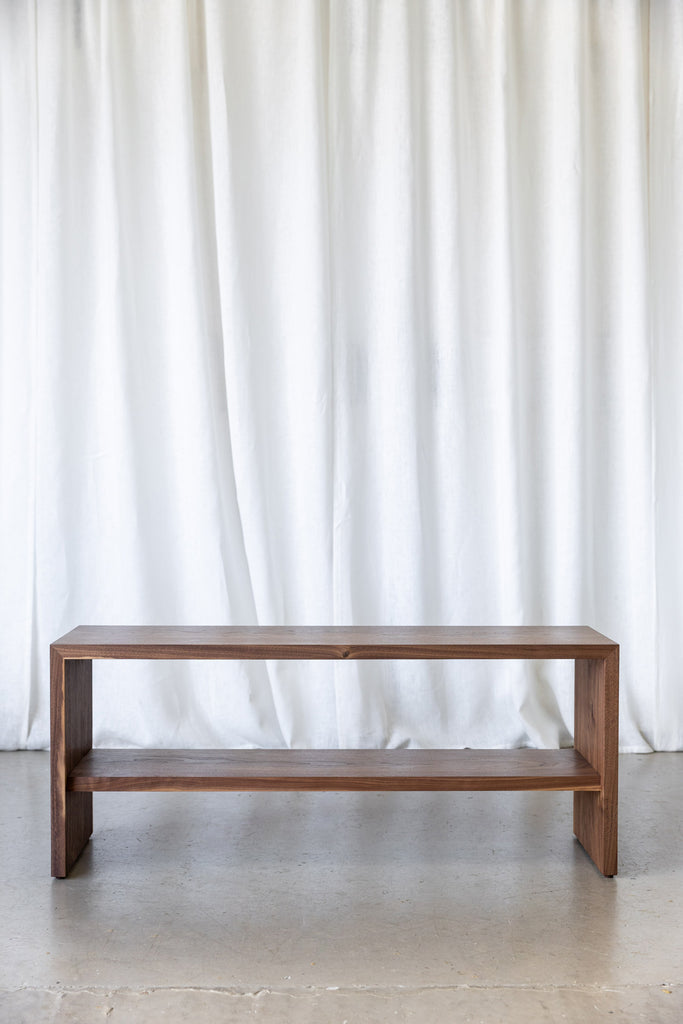 Front view of a solid wood hallway bench with a functional shelf, lovingly handmade in Hertford, UK.