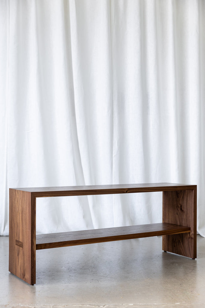 Handcrafted wooden bench with a functional shelf, ideal for shoe storage in the entryway, as a versatile dining room bench, or as a convenient end-of-bed perching seat.