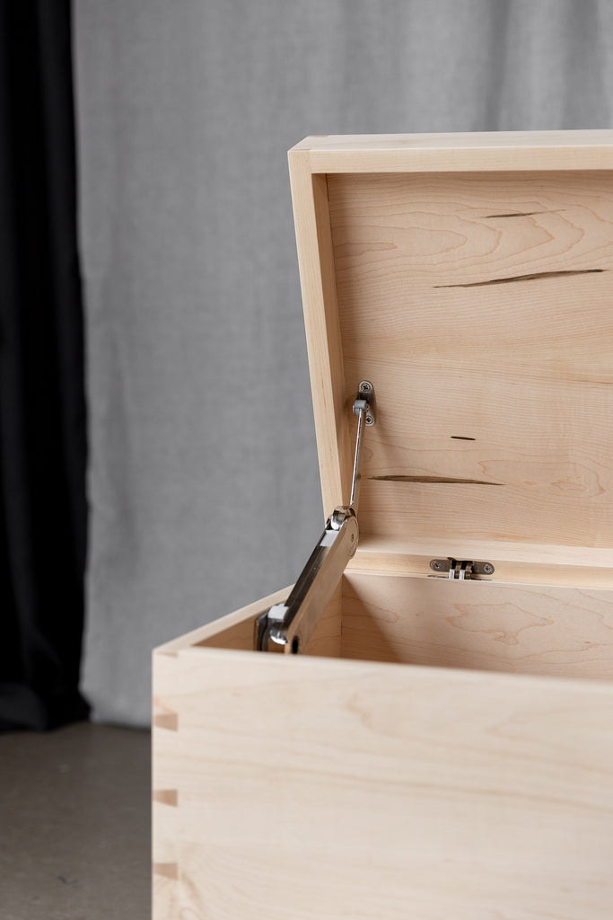 Close-up image showcasing the blanket box hardware, featuring a soft-close lid stay ensuring smooth and gentle closure.