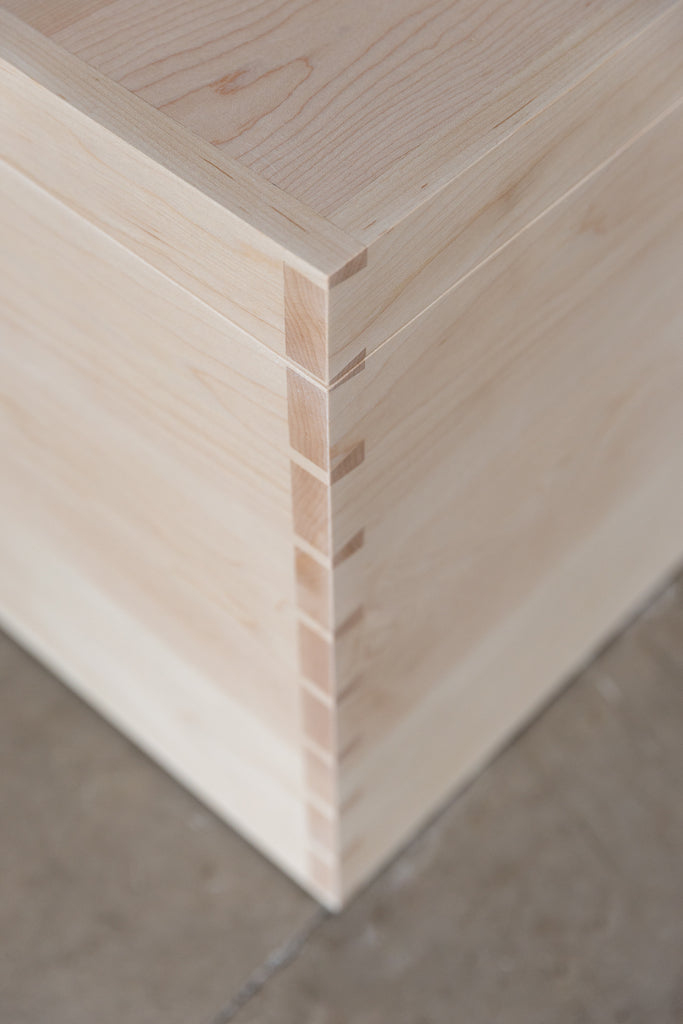 Close-up detail of corner dovetail joinery, renowned for its strength and durability, ensuring longevity and structural integrity