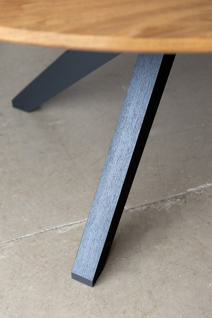 Close-up image highlighting the modern leg design of the table, drawing inspiration from mid-century modern aesthetics, embodying sleek lines and minimalist elegance.