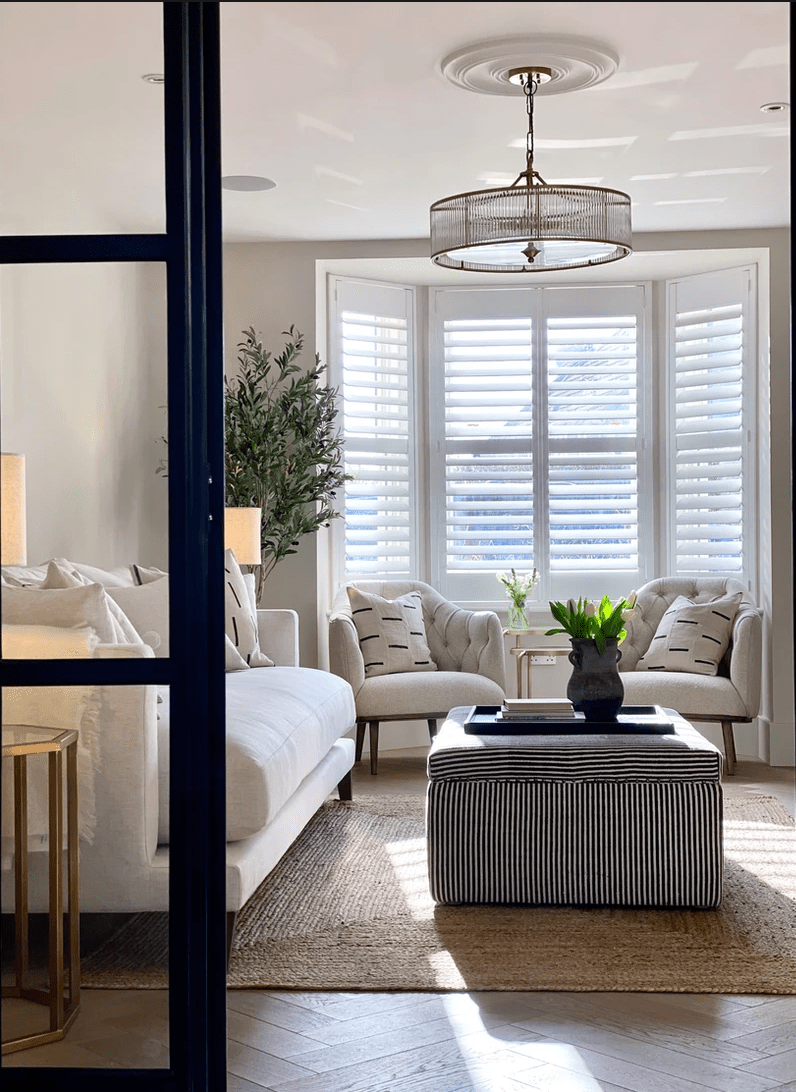 Living room designed by Leoma Harper from Interiors by Leoma Harper, featuring Martelo and Mo's 60x60cm black ottoman tray.