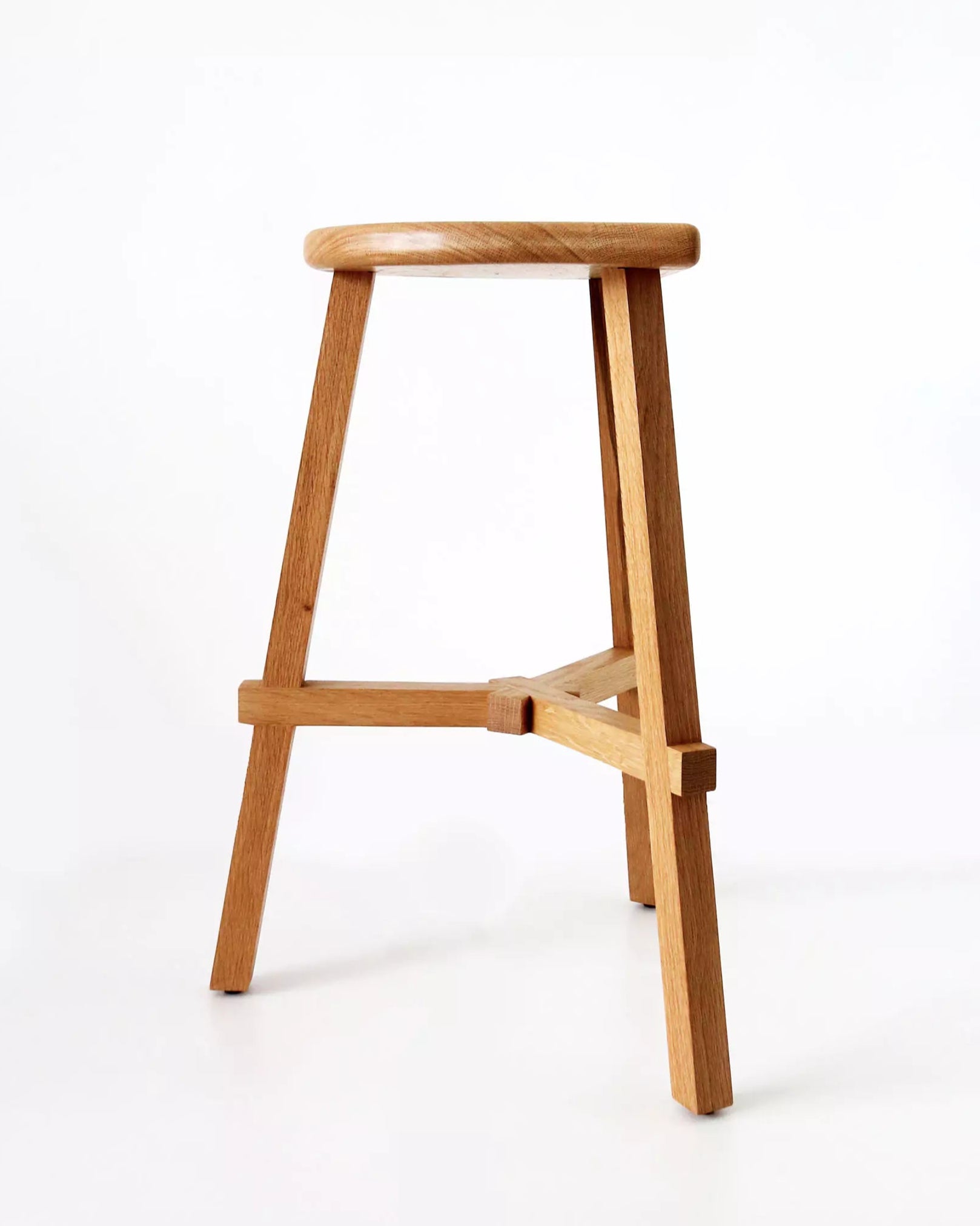 Wooden oak counter stool on a white background