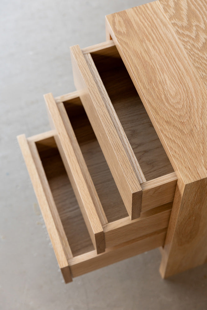 top view of the Gaia bedside cabinet with it's 3 drawers half opened