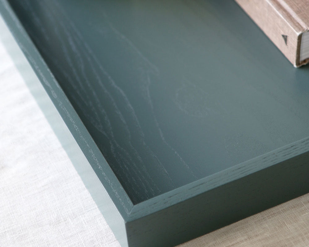 Angled close-up of the inside of the tray, highlighting its clean lines and subtle wood texture.