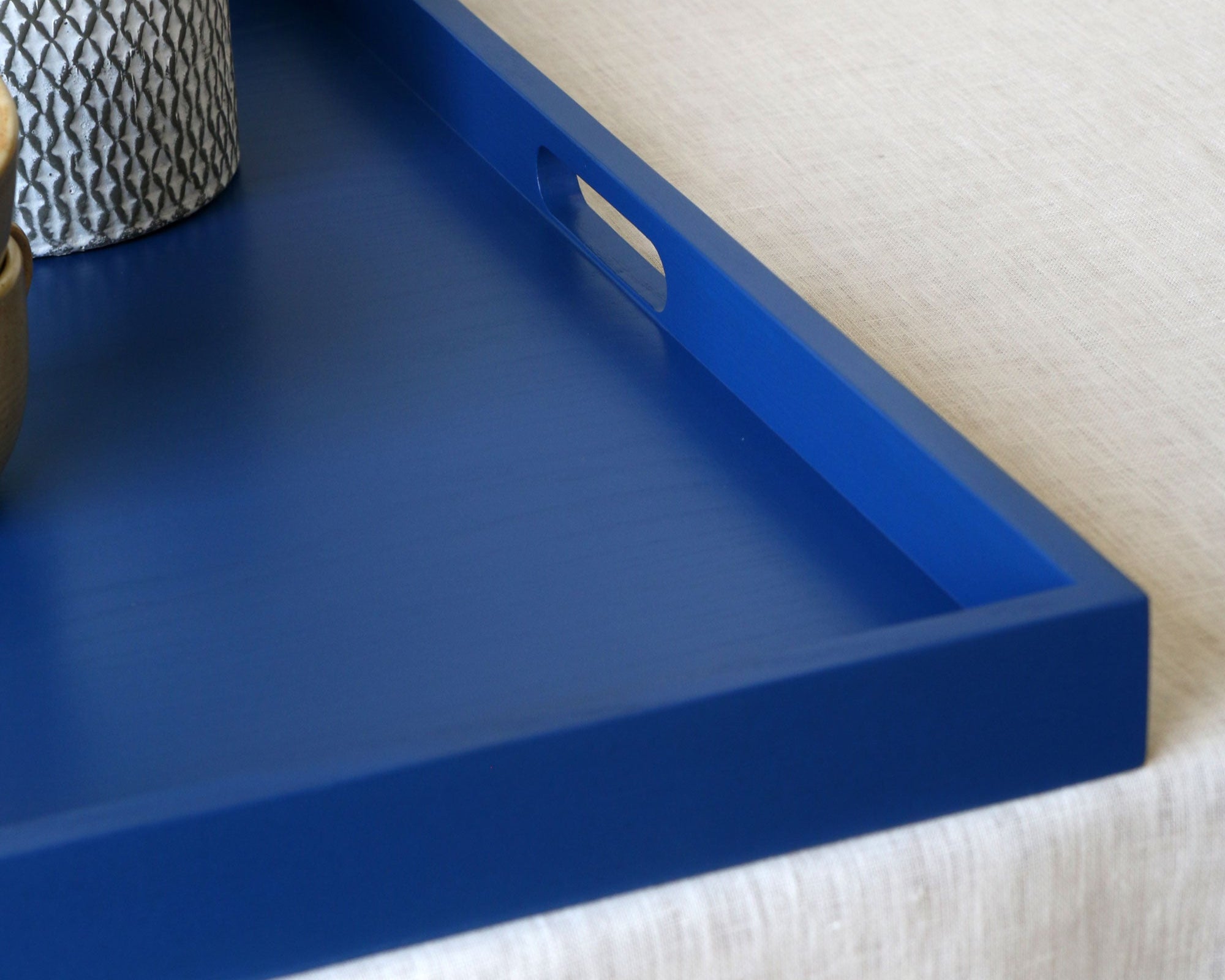 Close up of the blue tray's oval-shaped handle