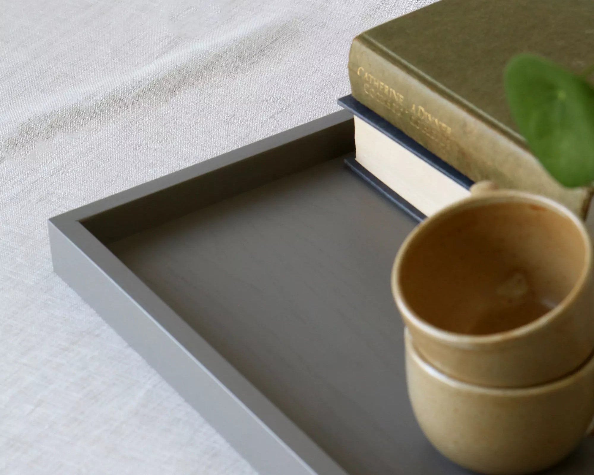 close-up of a grey lacquered tray and it's corner frame detail