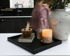 A handcrafted tray adding a functional and stylish touch to a contemporary interior space.