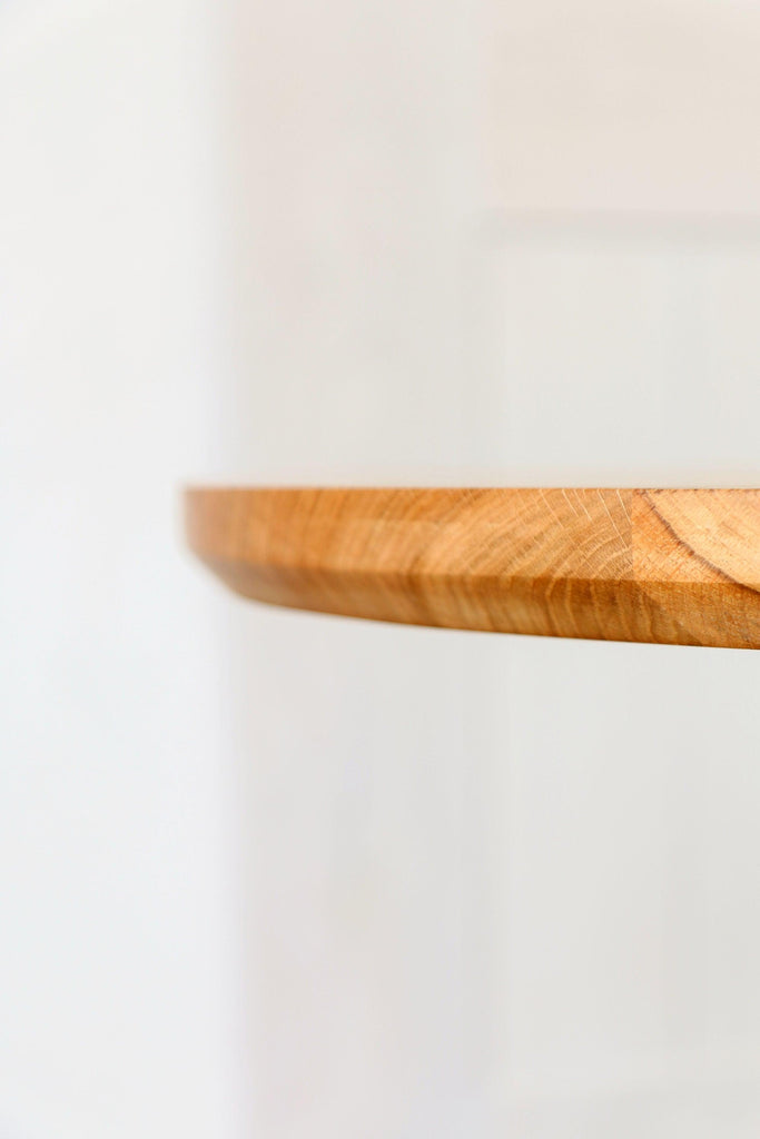 Close-up image highlighting the chamfered bottom edge of the table top.